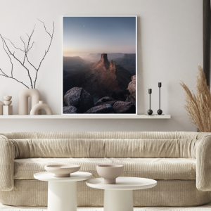 Photograph of night being taken over by dawn breaking over the rugged Southern Utah landscape.