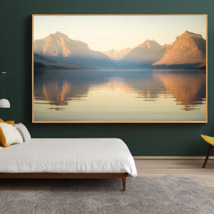 Photograph of a calm lake reflecting surrounding mountains at sunset, creating a serene and tranquil scene.